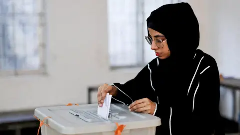 Reuters A woman votes in a designated area during the 13th general election in Dhaka, Bangladesh, February 12