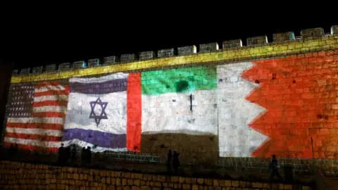 Reuters The flags of the United States, Israel, United Arab Emirates and Bahrain are projected on a section of the walls surrounding Jerusalem's Old City