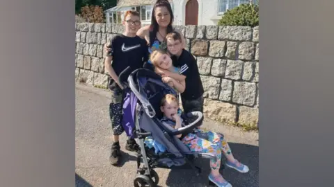 Family handout Amanda pictured with her children