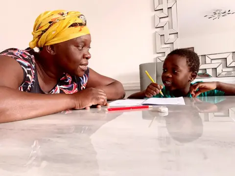 Marcela A mother home-schooling her son