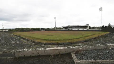 Pacemaker Broken terracing and an overgrown pitch at derelict stadium Casement Park