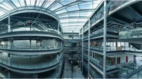 Patrick Olner Picture of bare interior of the new building