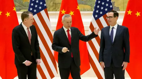 Getty Images (From L) US Trade Representative Robert Lighthizer, Chinese Vice Premier and lead trade negotiator Liu He and US Treasury Secretary Steven Mnuchin talk before the opening session of trade negotiations at the Diaoyutai State Guesthouse in Beijing on February 14, 2019