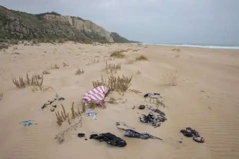 Kate Stanworth Clothes in the sand