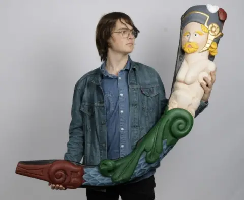 Poole Museum Student Joan Serra with merman sculpture