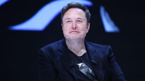 Elon Musk smiles on June 19, 2024 in Cannes, France.