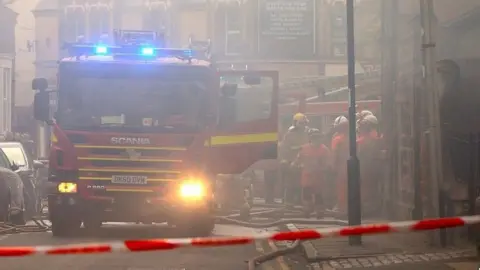 PA Firefighters at the scene of a fire in Liverpool