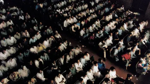 Getty Images A view from the balcony during a packed sold-out, mid-day show at New Shirin Talkies Cinema January 2002 in Mumbai, India.