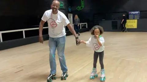 Paul Green with his granddaughter