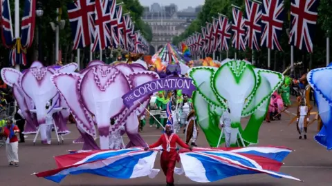 Getty Images Performers dressed as elephants