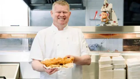 Andrew Crook Andrew runs a fish and chip shop and says many takeaways will face higher costs