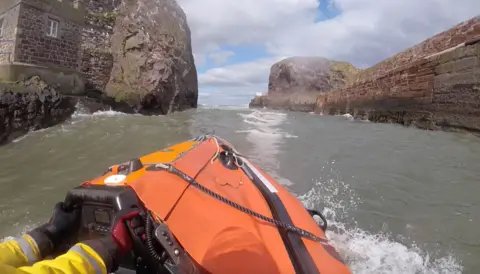 RNLI/Douglas Wight A lifeboat making its way out to sea