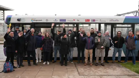 PA Media Self-driving bus passengers