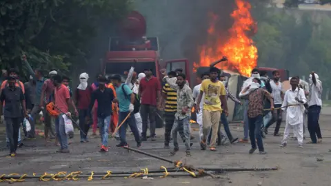 Getty Images Gurmeet Ram Rahim Singh's followers turned violent on Friday