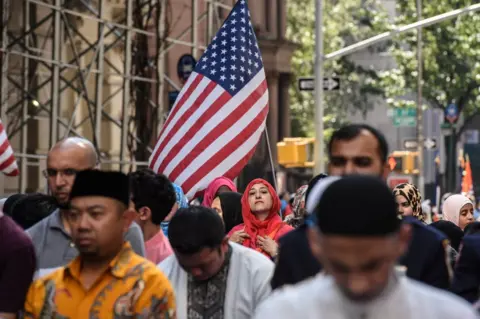 Stephanie Keith/ Reuters People participate in a group prayer in the street before the start of the annual Muslim Day Parade in New York City, US on 24 September 2017.