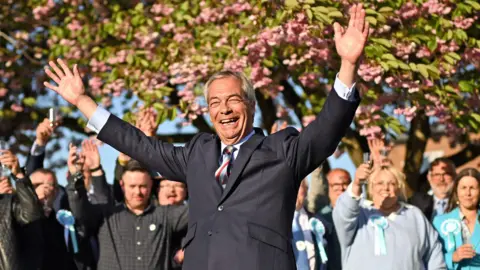 Nigel Farage celebrates with Reform UK supporters
