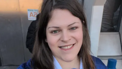 Contributed Jennifer Lees takes a selfie and is smiling at the camera. She has long brown hair and wears a blue Ipswich Town shirt.