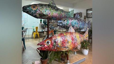 Sculpture of three large fish