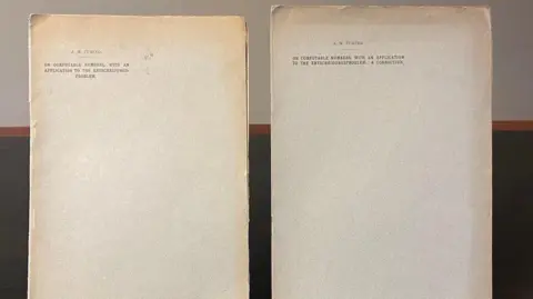 Rare Book Auctions Two old papers, slightly yellowing due to their age, with type-written words on the front, including Turing's name.