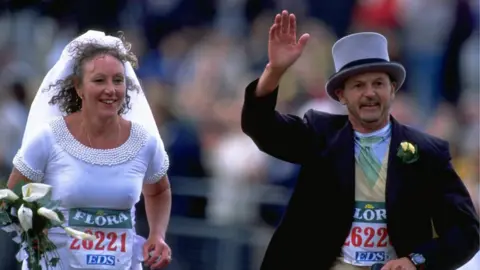 Getty Images A couple tie the knot during the 1999 London Marathon