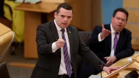 Reuters Douglas Ross speaks in the Scottish Parliament