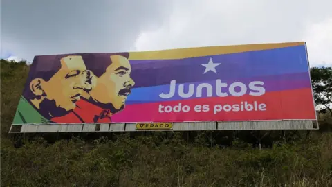 A campaign poster showing President Maduro and his predecessor, Hugo Chávez, reads: "Together everything is possible"