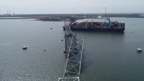 Reuters A drone view of the Dali cargo vessel, which crashed into the Francis Scott Key Bridge causing it to collapse, in Baltimore, Maryland, U.S., March 26, 2024, in this still image taken from a handout video