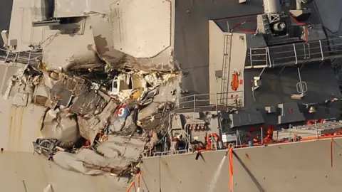 Reuters The Arleigh Burke-class guided-missile destroyer USS Fitzgerald, damaged by colliding with a Philippine-flagged merchant vessel, is towed into the U.S. naval base in Yokosuka