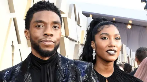 Getty Images Chadwick Boseman with wife Simone at the 2019 Academy Awards