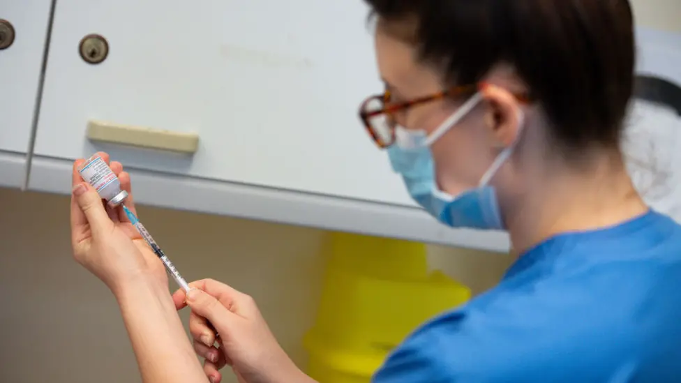 Getty Images Preparing a Moderna vaccine in Wales