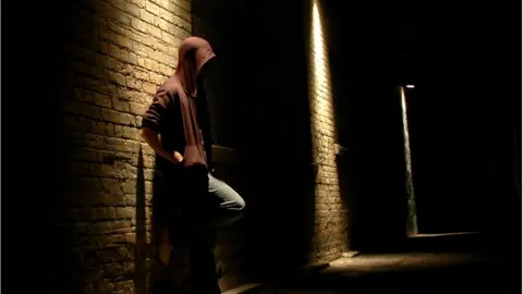 Getty Images Man in alley