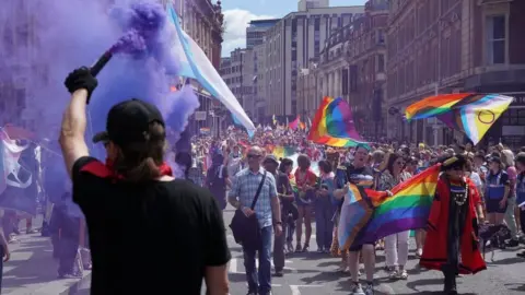 Nick Whimster A purple flare set of at the pride march