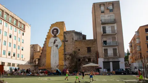 Kate Stanworth A mural of Saint Benedict in Palermo, Sicily, Italy