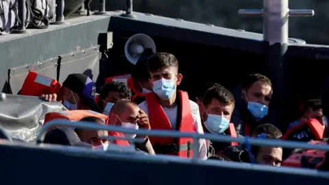 PA Media/Gareth Fuller Migrants arriving at Dover