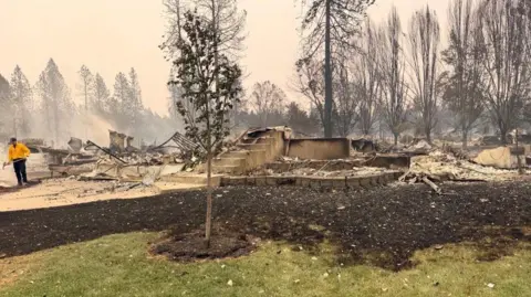 Amy Mulligan A view of Amy Mulligan's home in Spokane a day after a wildfire took hold of her neighbourhood 