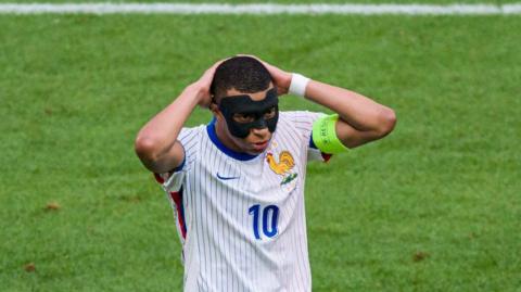 Kylian Mbappe reacts after France miss a chance against Belgium