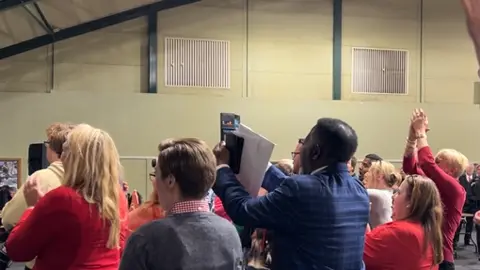 Deborah McGurran/BBC Labour group cheer as one of their candidates is elected in Southend-on-Sea.