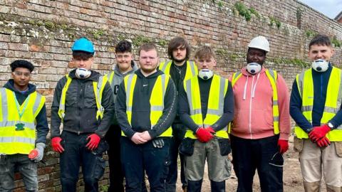A group of bricklaying students
