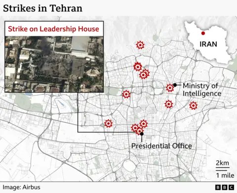 A detailed map of Tehran showing the locations of several reported strikes across the city. Red explosion icons mark four strike sites. One is near the Ministry of Intelligence in the north-central area. Two more are shown in the south‑central area close to the Presidential Office. An inset box on the left contains a satellite image labelled “Strike on Leadership House” showing damaged buildings and dark smoke marks.