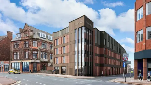 A computer-generated image of the planned Premier Inn at West Walls in Carlisle showing a contemporary red, brown and glazed roadside building set amid neighbouring red brick buildings.