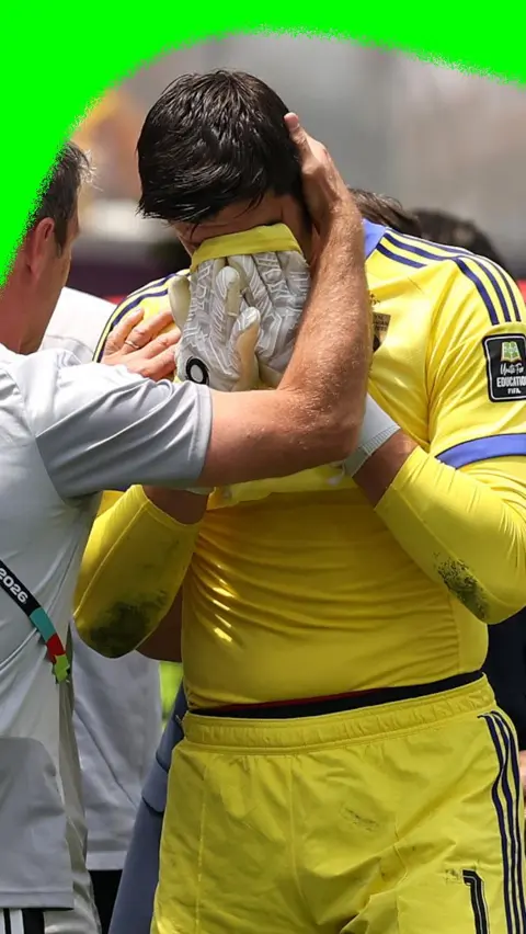 Thibaut Courtois wiping his tears with his shirt as he comes off while Belgium play Spain in the 2026 World Cup.