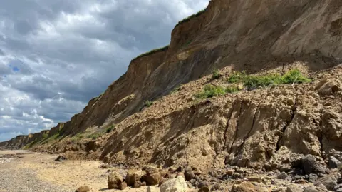 Shaun Whitmore/BBC Erosion on Sheringham beach