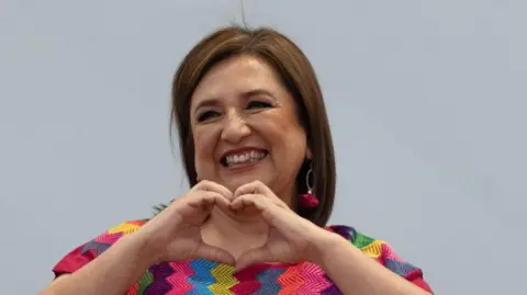 Reuters Xochitl Galvez, presidential candidate of the 'Fuerza y Corazon por Mexico' alliance of opposition parties gestures as she meets with members of the LGBTQ+ community, ahead of the June 2 general election, in Mexico City, Mexico, May 17, 2024