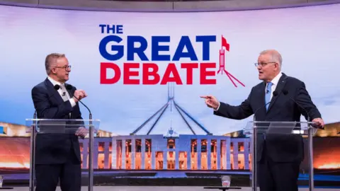 Getty Images Australian Prime Minister Scott Morrison (R) and the Labor leader Anthony Albanese (L) in a televised debate.
