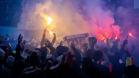 Shuttershock Maccabi Tel Aviv supporters gather at De Dam in Amsterdam ahead of the UEFA Europa League match between Ajax and Maccabi Tel Aviv in Amsterdam.