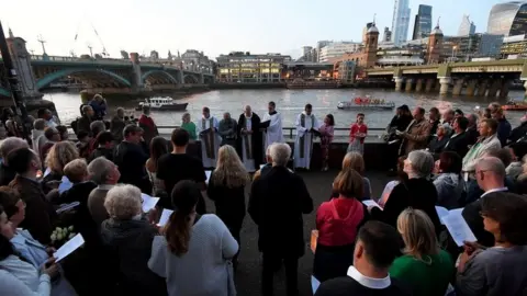 PA Media Memorial held on banks of Thames