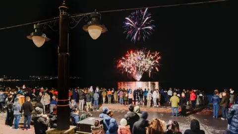 DOUGLAS COUNCIL People watching fireworks on Douglas Promenade
