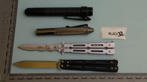 Counter Terrorism Policing East Midlands Two batons and laid out next to two knives