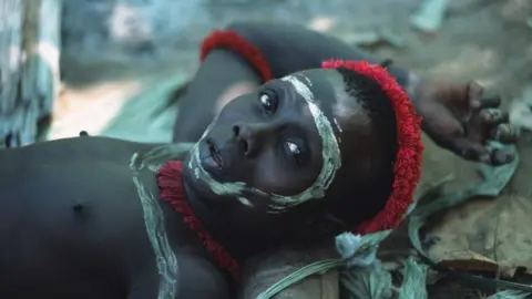 Getty Images A Jarawa man with a painted face