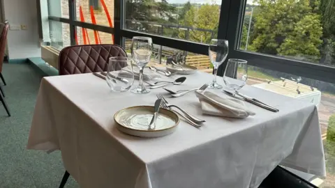 A table set for service at the Michael Caines Academy restaurant